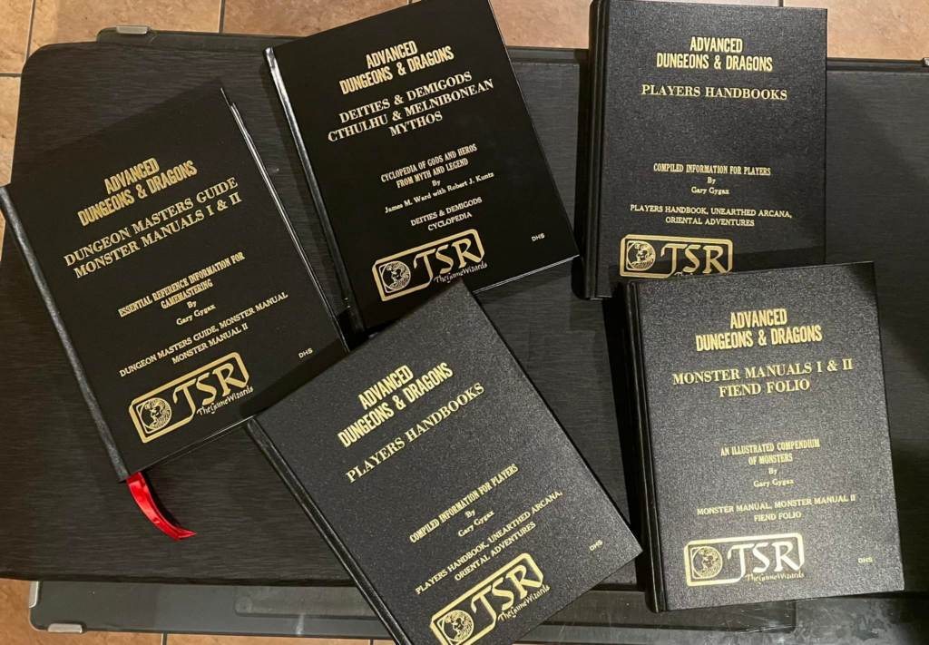 A collection of 5 generic hardback rebinds of 1st Edition D&D books - the are gold on black, looking very generic with the only flare being the inclusion of the TSR Game Wizards trademark.
