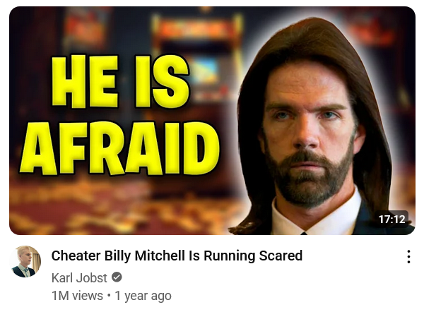 Screenshot of Karl Jobst's "Cheater Billy Mitchell Is Running Scared" video, which uses a photo of Billy and "HE IS AFRAID".